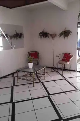Uma área de estar em Apartamento amplo em Meia Praia sc