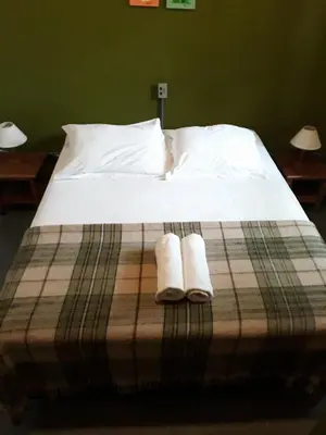Uma cama ou camas num quarto em Cabanas Do Araçá Villa