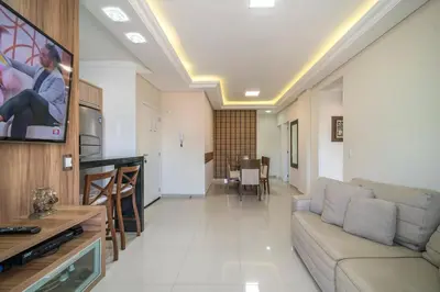 Uma televisão e/ou sistema de entretenimento em Apartamento Palazzo Em bombinhas