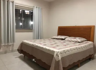 Uma cama ou camas num quarto em Casa 3 Quartos Praia Bombas Bombinhas SC