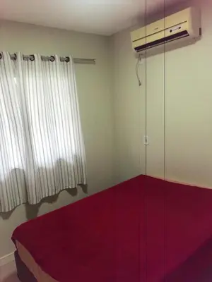 Uma cama ou camas num quarto em Casa segundo piso acomoda até 6 pessoas