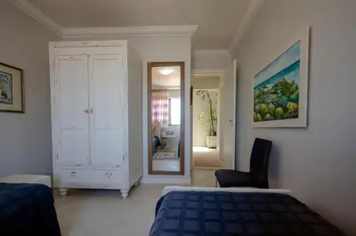 Uma cama ou camas num quarto em Ed Baia Azul Centro Bombinhas