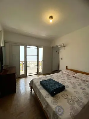 Uma cama ou camas num quarto em Casa espaçosa a 100m do mar