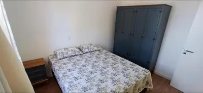 Uma cama ou camas num quarto em Apartamento NOVO Itapema 2 quartos e 2 vagas garagem 6 pessoas
