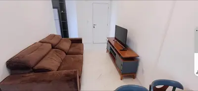Uma televisão e/ou sistema de entretenimento em Apartamento NOVO Itapema 2 quartos e 2 vagas garagem 6 pessoas