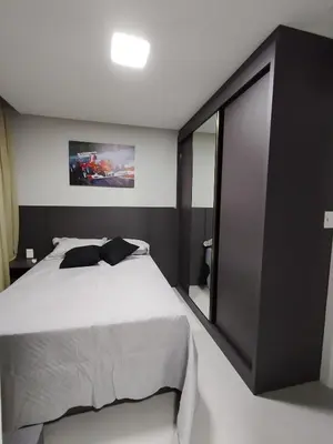 Uma cama ou camas num quarto em Apartamento Meia Praia