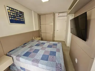 Uma televisão e/ou sistema de entretenimento em Apartamento Palmas Premier