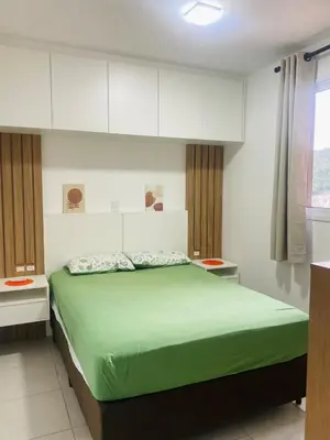 Uma cama ou camas num quarto em Apartamento em Itapema!