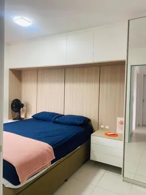Uma cama ou camas num quarto em Apartamento em Itapema!