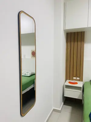 Uma cama ou camas num quarto em Apartamento em Itapema!