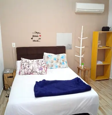 Uma cama ou camas num quarto em Casa Sunset, com vista Mares dos Ganchos, Governador Celso Ramos