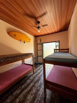 Uma cama ou camas num quarto em Casa Praia de Bombas 6 Pessoas - Casa Bicicleta