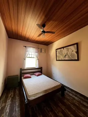 Uma cama ou camas num quarto em Casa Praia de Bombas 6 Pessoas - Casa Bicicleta