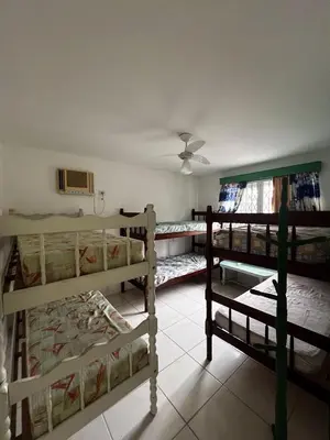 Uma cama ou camas num quarto em Casa 12 Pessoas Praia Bombas