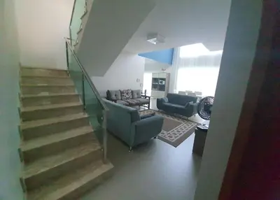 Uma área de estar em Casa Entre Verde e Mar Praia do Mariscal