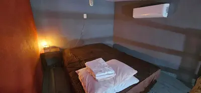 Uma cama ou camas num quarto em Refúgio da Conceição