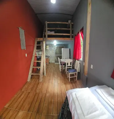 Uma cama ou camas num quarto em Refúgio da Conceição