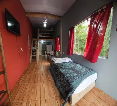 Uma cama ou camas num quarto em Refúgio da Conceição