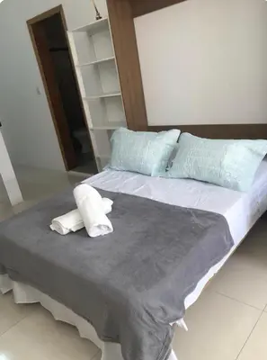Uma cama ou camas num quarto em Apto Térreo -Residencial da Ju