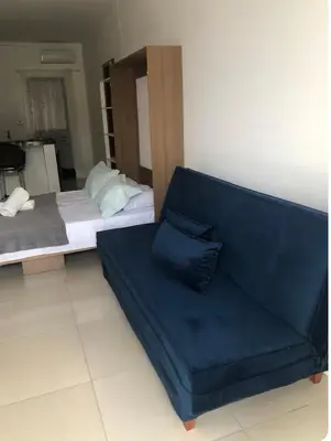 Uma área de estar em Apto Térreo -Residencial da Ju