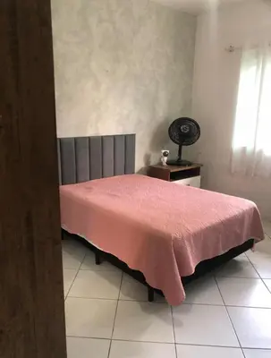 Uma cama ou camas num quarto em Casa Balneário Camboriú