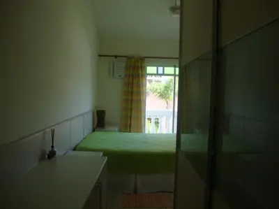Uma cama ou camas num quarto em Sobrado espetacular na bela praia de Palmas