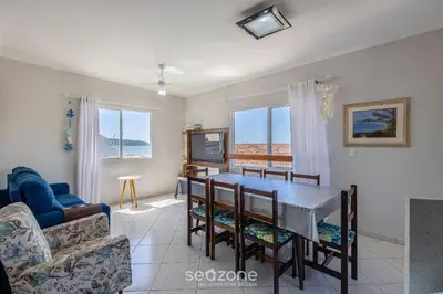 Uma área de estar em Apto Vista Mar 3Q e Garagem 130m da Praia ROR0002