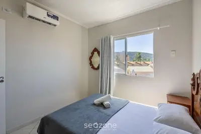 Uma cama ou camas num quarto em Apto Vista Mar 3Q e Garagem 130m da Praia ROR0002