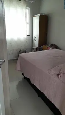 Uma cama ou camas num quarto em Casa completa a 15 cuadras de la playa