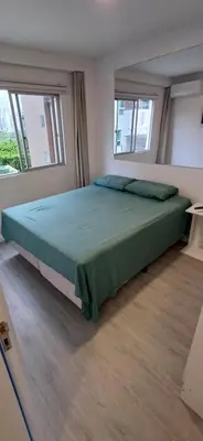 Uma cama ou camas num quarto em Paraíso em Balneário Camboriú