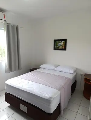 Uma cama ou camas num quarto em Apto 2 Qtos c AR-Baln Camboriu-Portaria 24hr