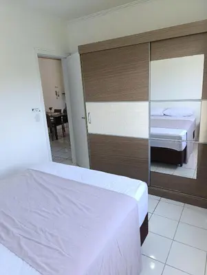 Uma cama ou camas num quarto em Apto 2 Qtos c AR-Baln Camboriu-Portaria 24hr