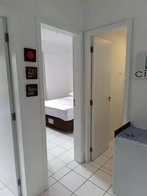 Uma cama ou camas num quarto em Apto 2 Qtos c AR-Baln Camboriu-Portaria 24hr