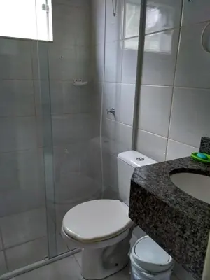Uma casa de banho em Ótima Casa em Itapema SC