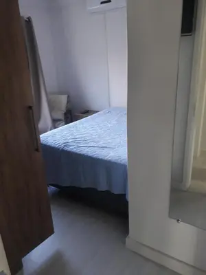 Uma cama ou camas num quarto em Lindo apartamento próximo a praia em Itapema - SC!