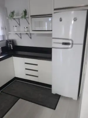 A cozinha ou kitchenette de Lindo apartamento próximo a praia em Itapema - SC!