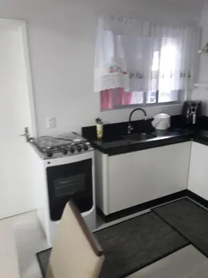 A cozinha ou kitchenette de Lindo apartamento próximo a praia em Itapema - SC!