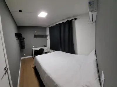 Uma cama ou camas num quarto em Casa da Sil com garagem, ar, wifi, perto Expocentro