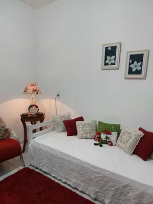 Uma cama ou camas num quarto em Porto Belo Perequê