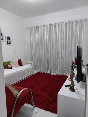 Uma cama ou camas num quarto em Porto Belo Perequê