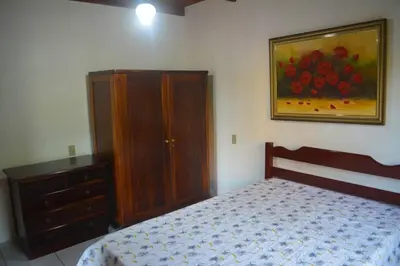 Uma cama ou camas num quarto em Sobrado Familiar da Salete 01