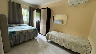 Uma cama ou camas num quarto em casa espaçosa para ate 10 pessoas em Bombinhas