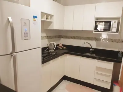 A cozinha ou kitchenette de casa espaçosa para ate 10 pessoas em Bombinhas