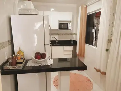A cozinha ou kitchenette de casa espaçosa para ate 10 pessoas em Bombinhas