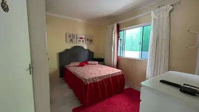Uma cama ou camas num quarto em casa espaçosa para ate 10 pessoas em Bombinhas
