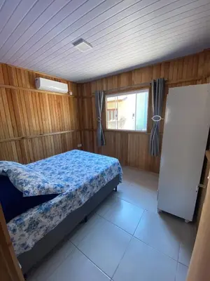 Uma cama ou camas num quarto em Casa Aluguel Porto Belo