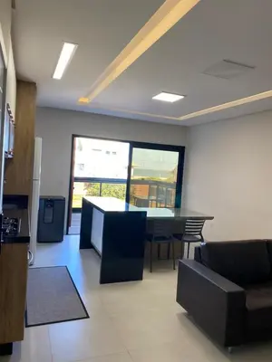 Uma televisão e/ou sistema de entretenimento em Apto 3 quartos a 70 metros da praia de Palmas SC