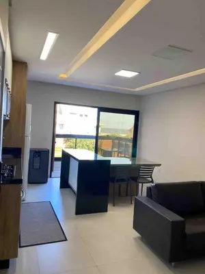 Uma televisão e/ou sistema de entretenimento em Apto 3 quartos a 70 metros da praia de Palmas SC