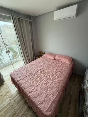 Uma cama ou camas num quarto em Hospedagem da Marli
