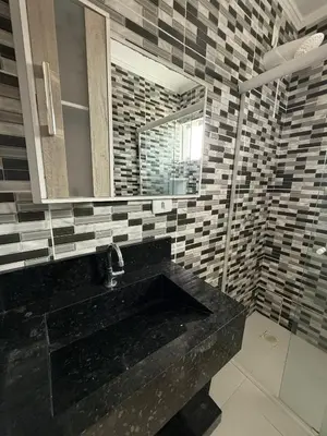 Uma casa de banho em Hospedagem da Marli